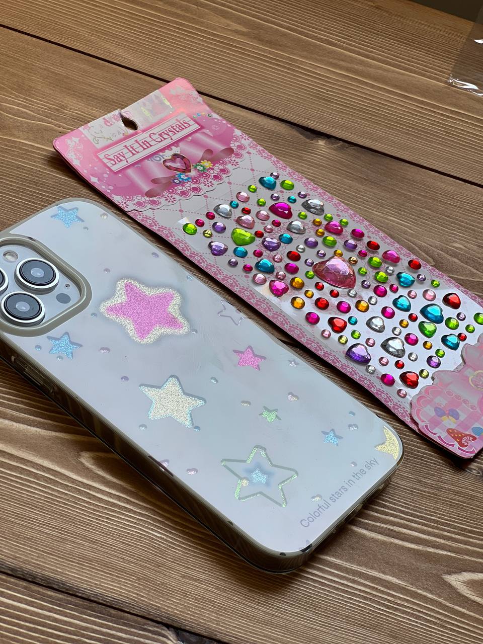 قاب آیفون ستاره های شنی به همراه صفحه کریستالی چسبی