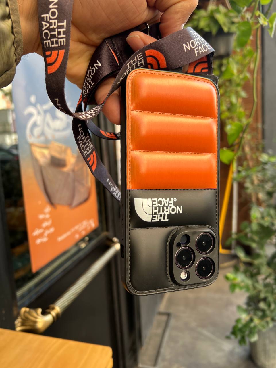 قاب North Face Orange Puffer همراه با بند هدیه