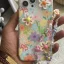 قاب آیفون گل بابونه رنگی رنگی برجسته + بندست